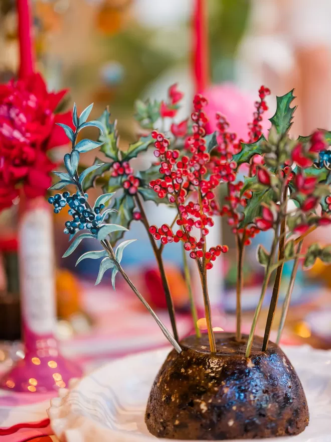 Amy Swann handpainted wooden flowers seen in a Christmas pudding