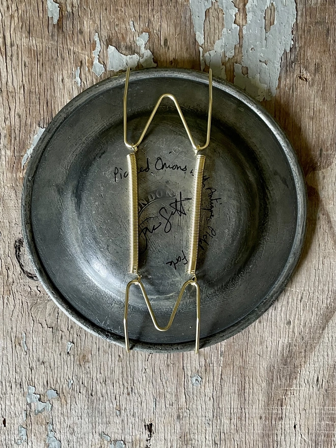 plate hanger on pewter plate
