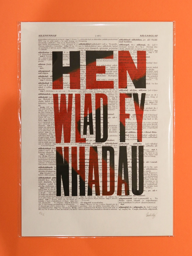Hen Wlad linocut print on a welsh dictionary