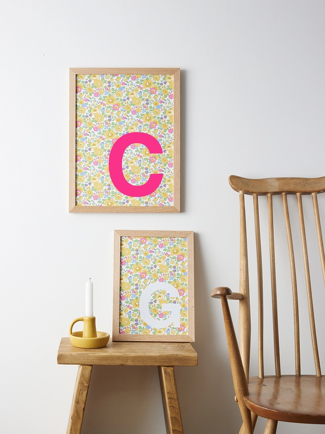 Personalised framed neon pink and white initials on Liberty Betsy yellow fabric