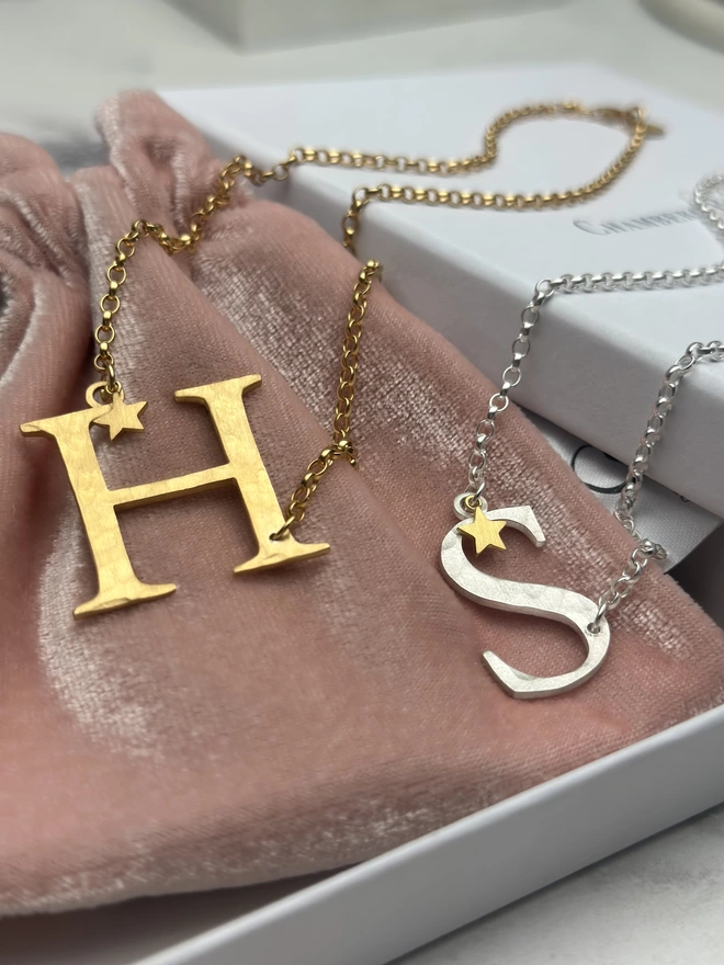sterling silver S letter charm on silver chain with gold mini star charm and gold plate H letter charm on gold chain with gold mini star. With gift box