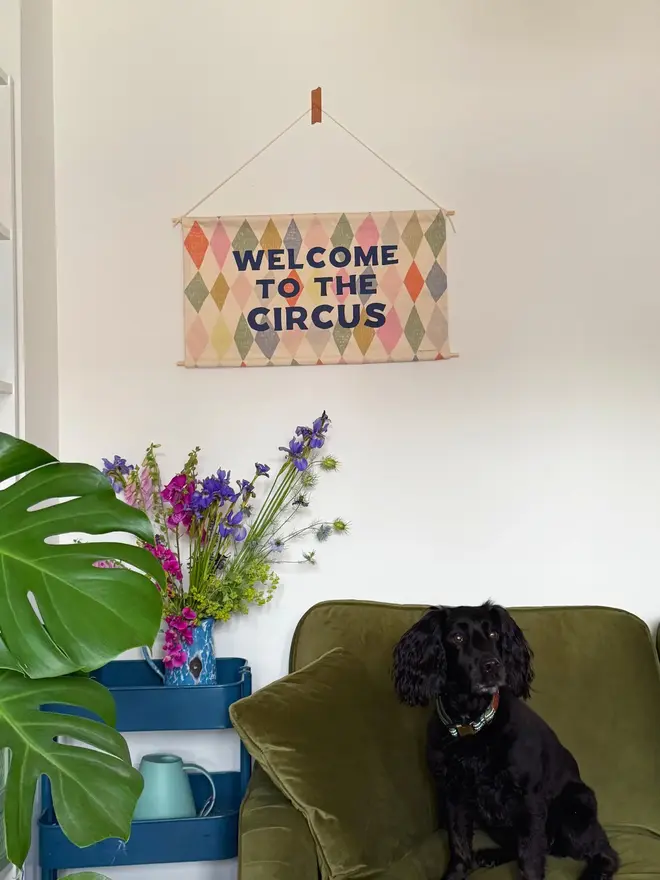 'Welcome To The Circus' Cotton Wall Hanging, hanging on a white wall. 