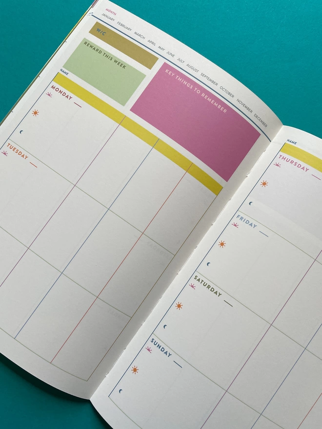 Inside undated weekly spread of colourful Raspberry Blossom Family Weekly Planner