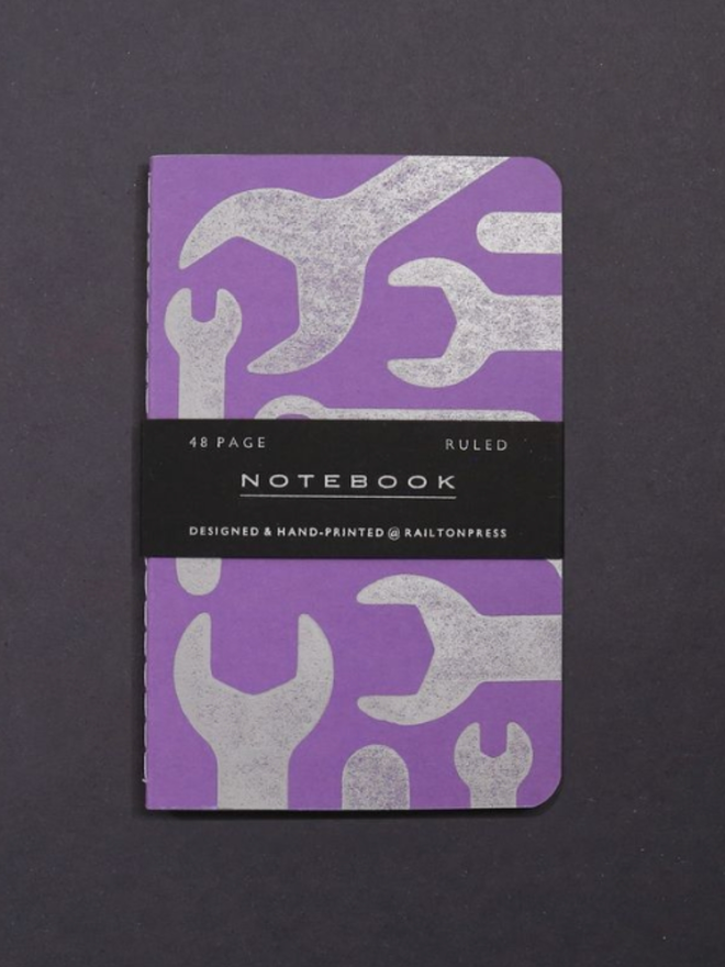 Lined Spanner Pocket Notebook. A notebook in purple