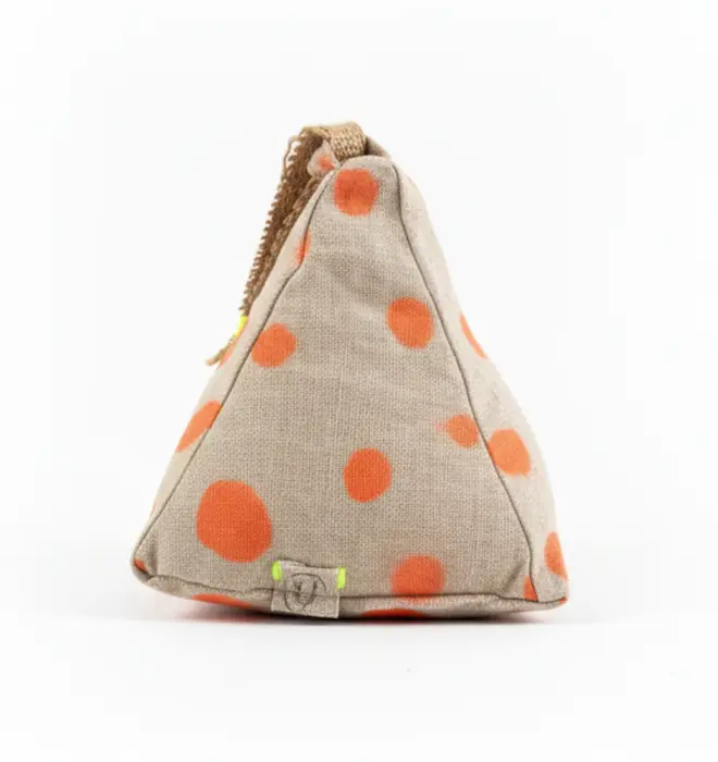 Hand Painted Linen Sustainable Doorstop In Polka Dot Print, a colourful neon orange doorstop against a white background. 