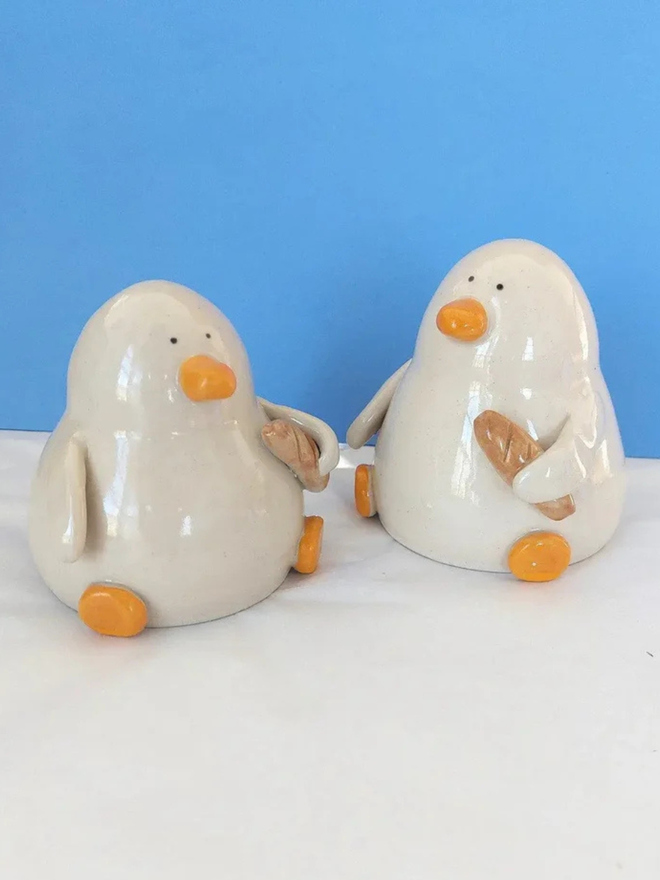 Duck with a baguette sculpture