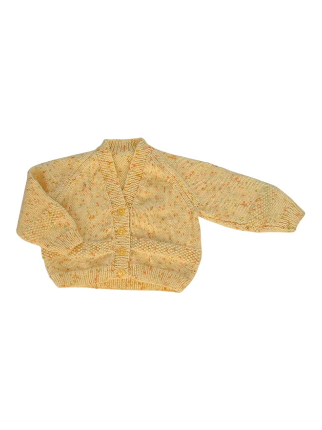 blank knitted cardigan on white backdrop