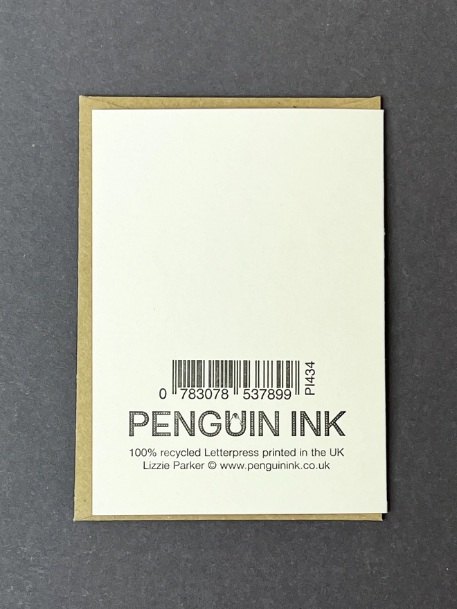 Back of a little note card showing the letterpress printed barcode and Penguin Ink logo