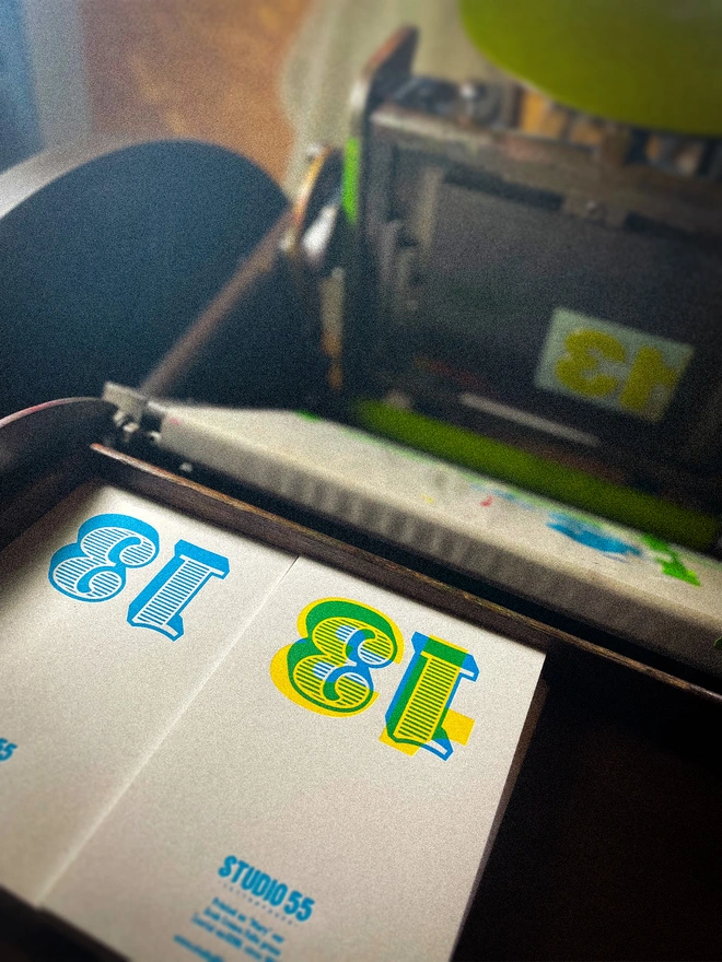 Handmade 13th birthday milestone card on a vintage letterpress, showing the colourful number 13 built up from overlapping cyan, magenta and yellow inks. Individually hand printed using multiple colour passes on thick GF Smith Colorplan card.