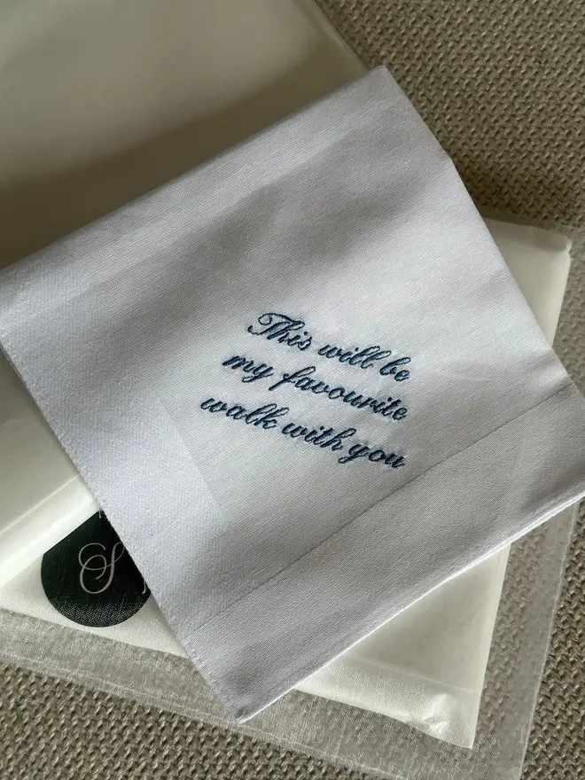 white handkerchief with blue text