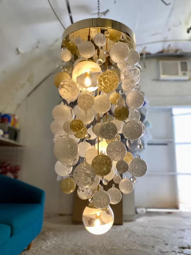 Bespoke chandelier with a gold frame
