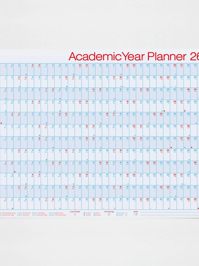 Photo of an academic year planner for the year 2026-2027 design in red and blue on 100% recycled white paper