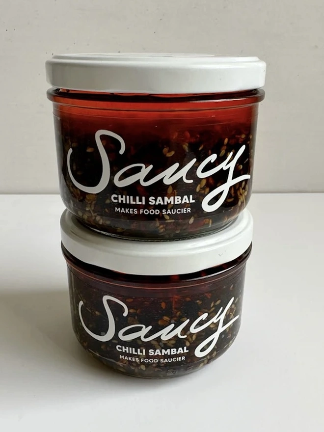 Chilli Sambal (Set Of 2), a pair of chilli sambals sitting on a white table against a grey backdrop. 