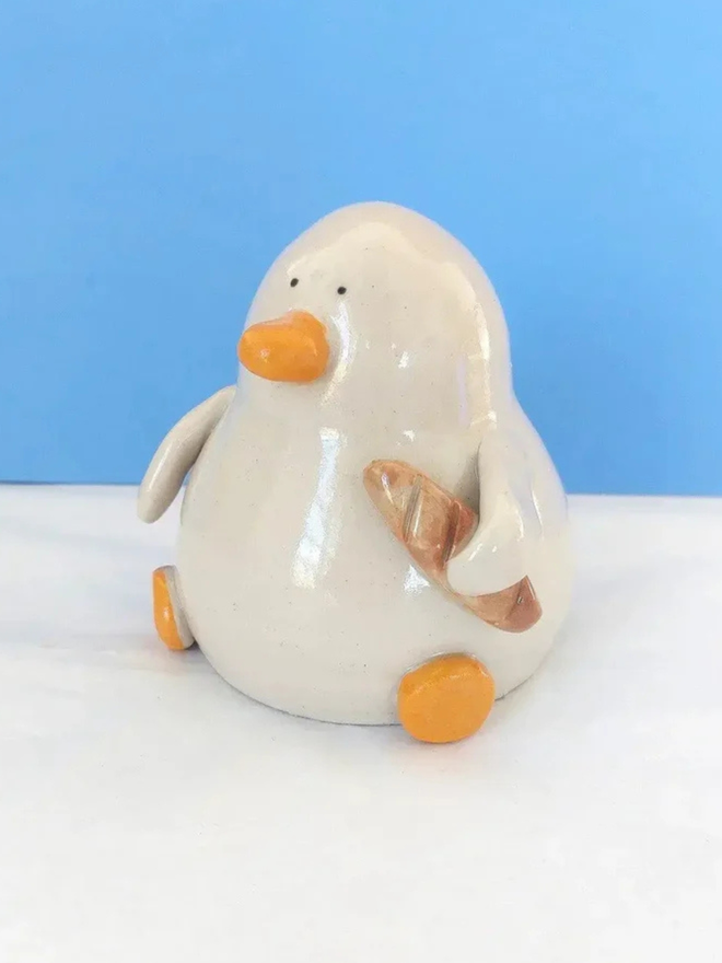 Duck with a baguette sculpture