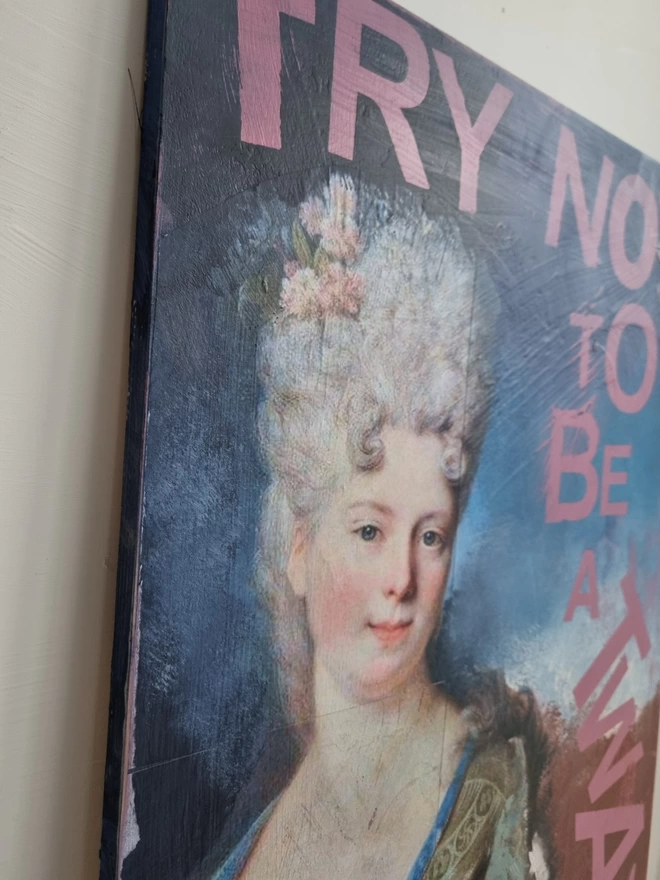 Painted and decoupage art panel featuring an antique portrait of an aristocratic lady and pink wording that reads ‘try not to be a twat’