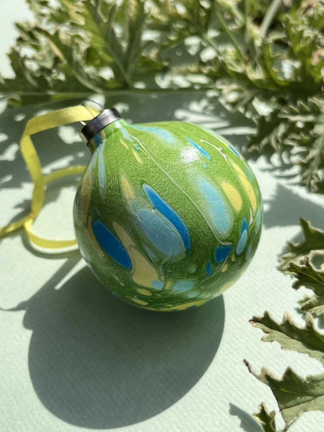 Hand-marbled round ceramic Christmas bauble