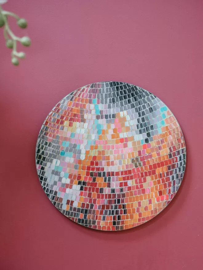 Large Hand-Painted Shiny Disco Ball (Pink/Orange) seen on a pink wall.