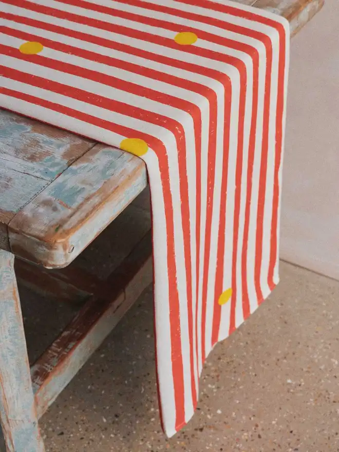 Red stripe yellow dot table runner