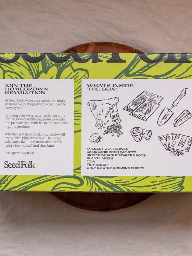 the seed growing starter kit. box in a decorative green sleeve photographed from the back to show instructions.