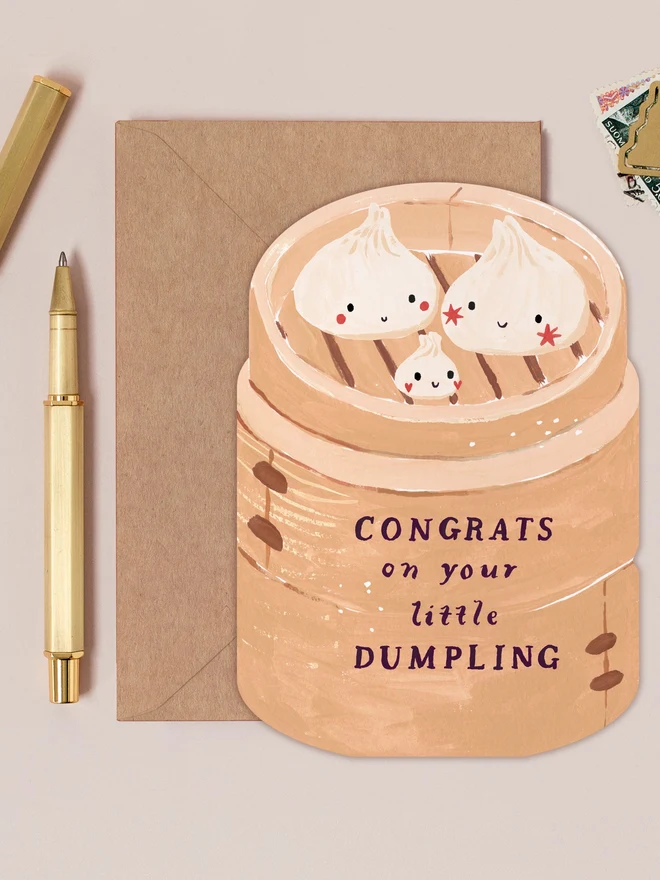 Dumpling New Baby Card by Sister Paper Co with a kraft envelope