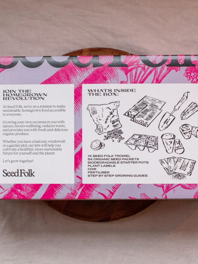 the seed growing starter kit. box in a decorative pink sleeve photographed from the back to show instructions.