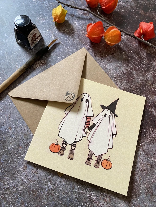 greeting card featuring 2 children ghosts in fancy dress going trick or treating