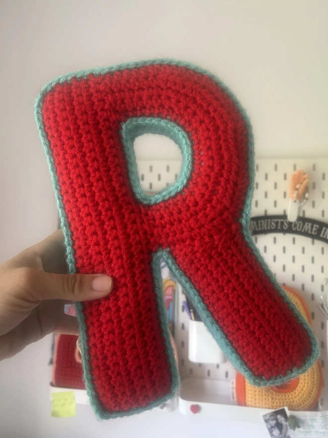 Crochet R cushion in Red and Teal