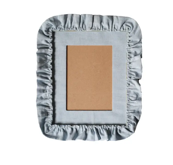 picture frame with blue ruffled border and mount