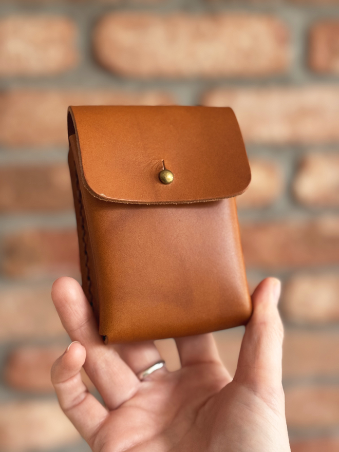 tan leather deck of cards holder.