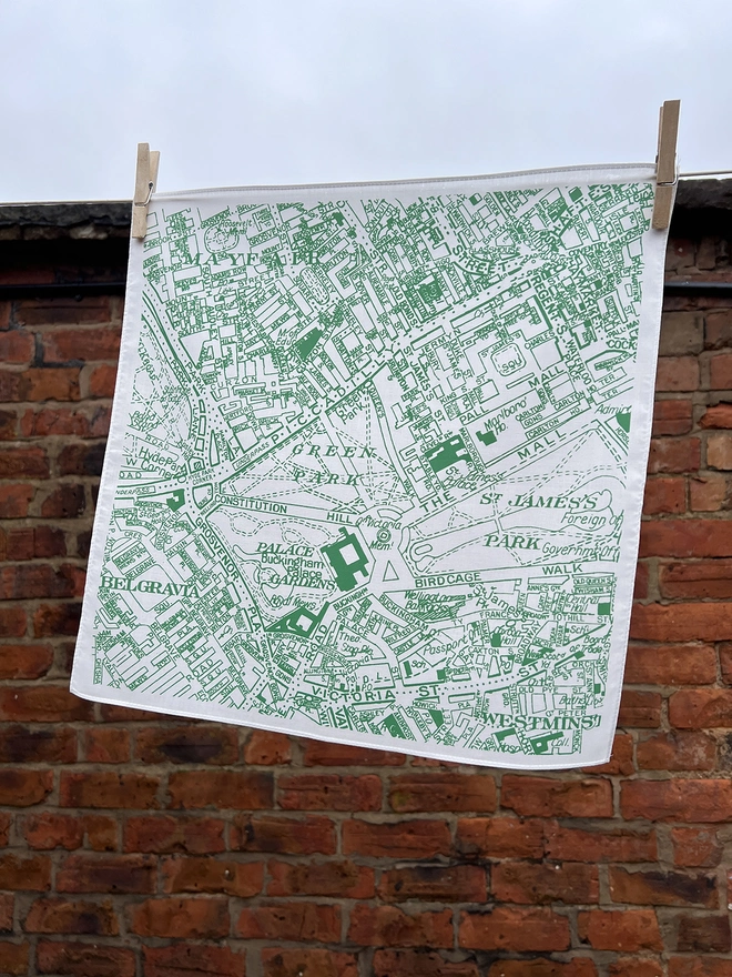A Mr.PS London Piccadilly printed handkerchief hanging on a washing line