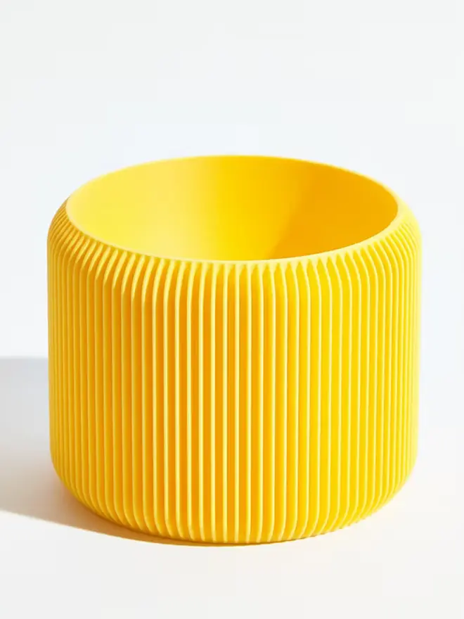 Sustainable 3D Printed Banana Yellow Plant Pot, turbin design against a white background.