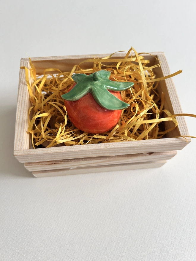 single tomato snuffer in basket