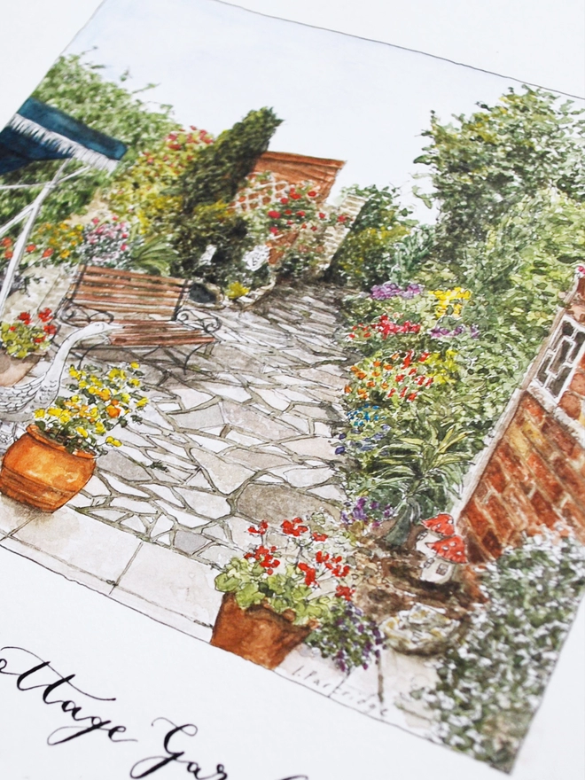 Close up of a watercolour illustration of an old cottage garden. In the centre is a crazy paved garden with brick wall and planted border to the right, swing seat, pond, shed and pots to the left. 