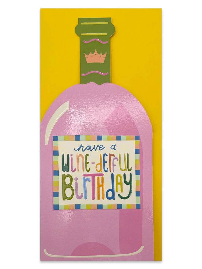 The vibrant Raspberry Blossom ‘Have a wine-derful Birthday’ card sits on a sunshine yellow envelope