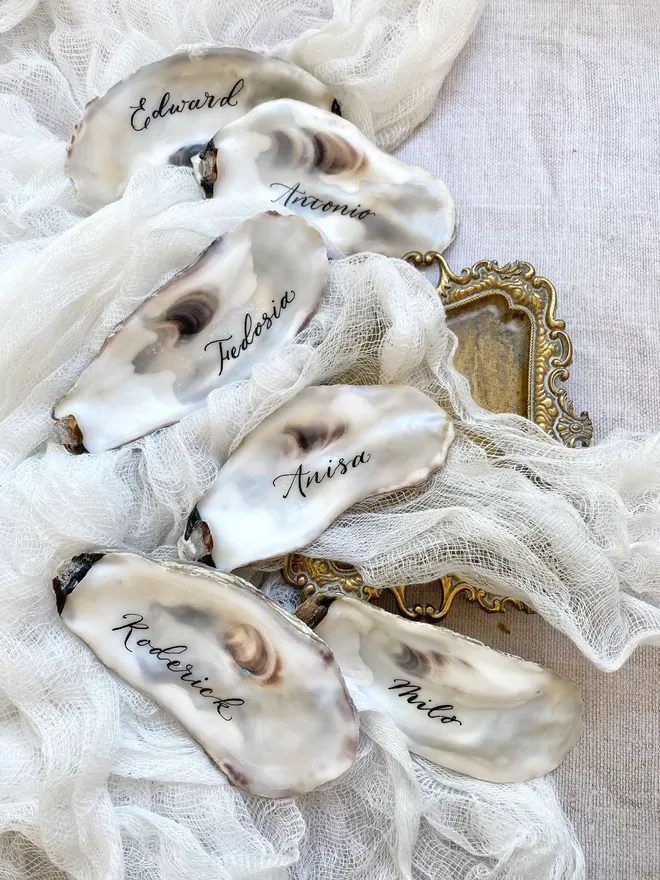 oyster shell place names for weddings written by hand