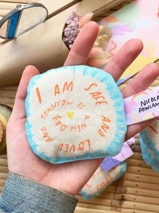 Blue sensory bag reads 'I am safe and loved and tomorrow is a new day'