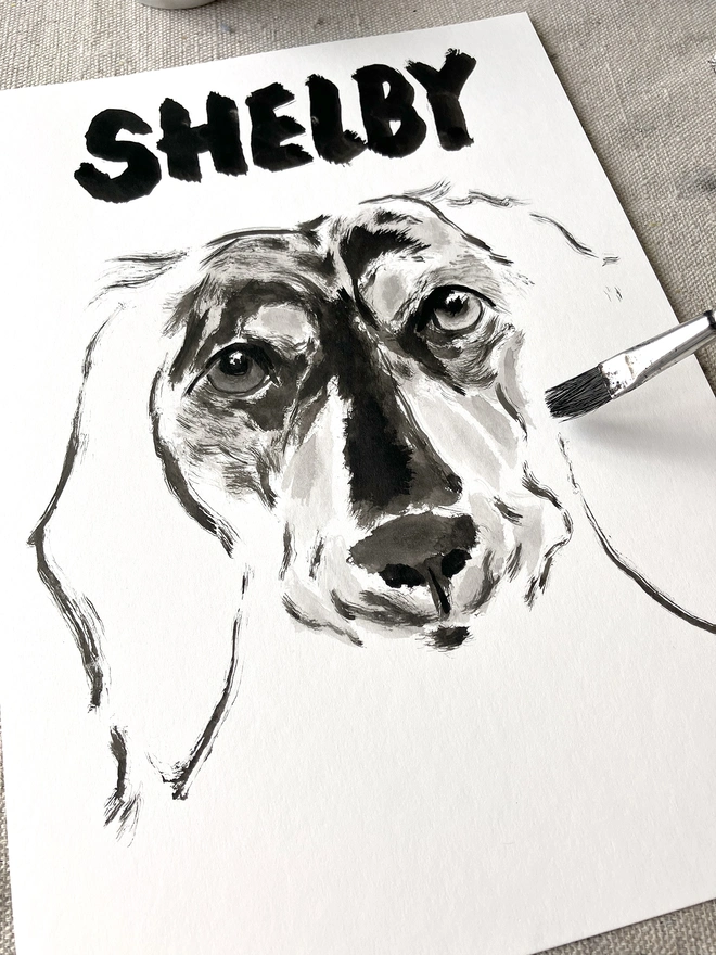 artist 'Dogs by Jeff' painting a personalised dog portrait of a long haired dachshund 