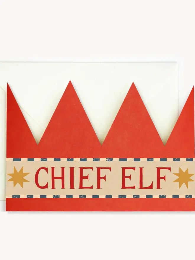 red paper crown card with chief elf text