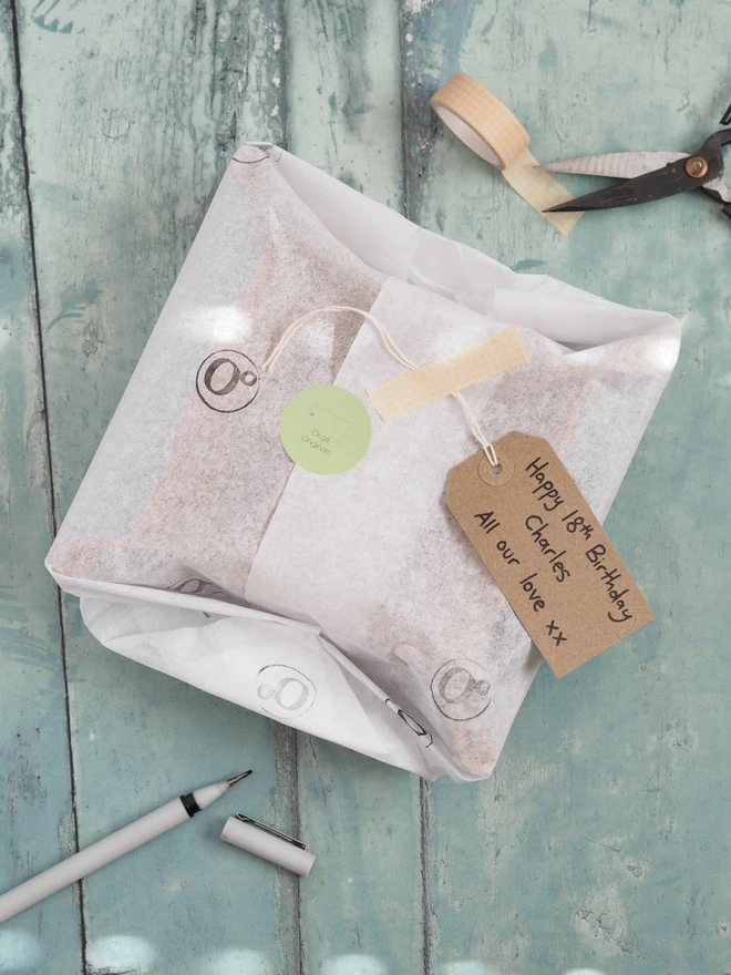 Personalised leather coin tray. Wrapped in tissue paper with a hand written gift tag, ready for gifting.