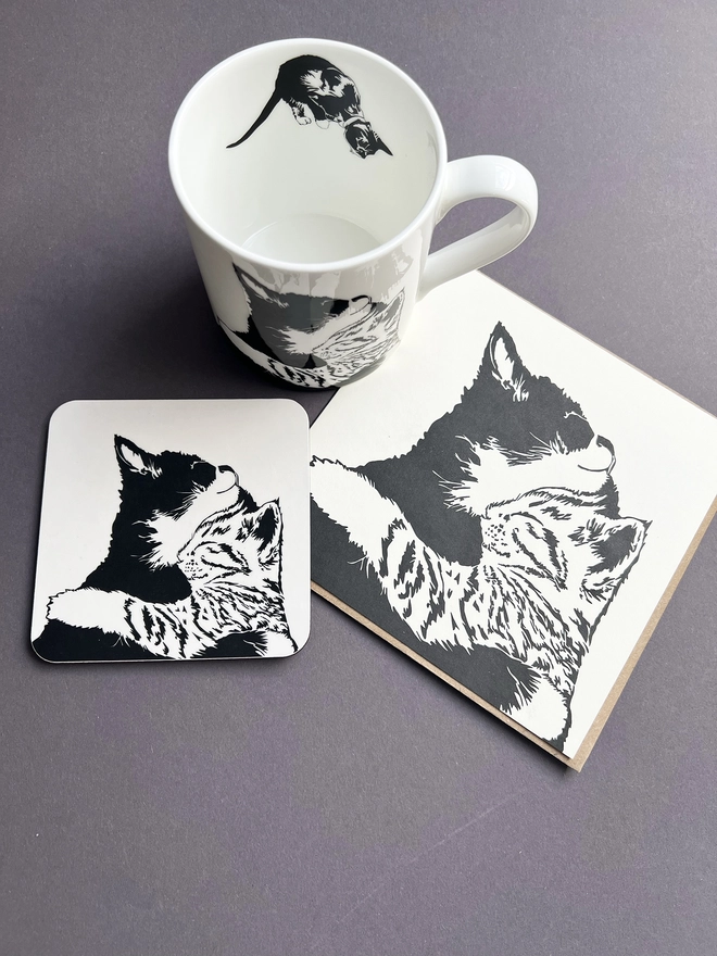 Melamine coaster illustrated with two cuddling cats with matching greetings card and mug
