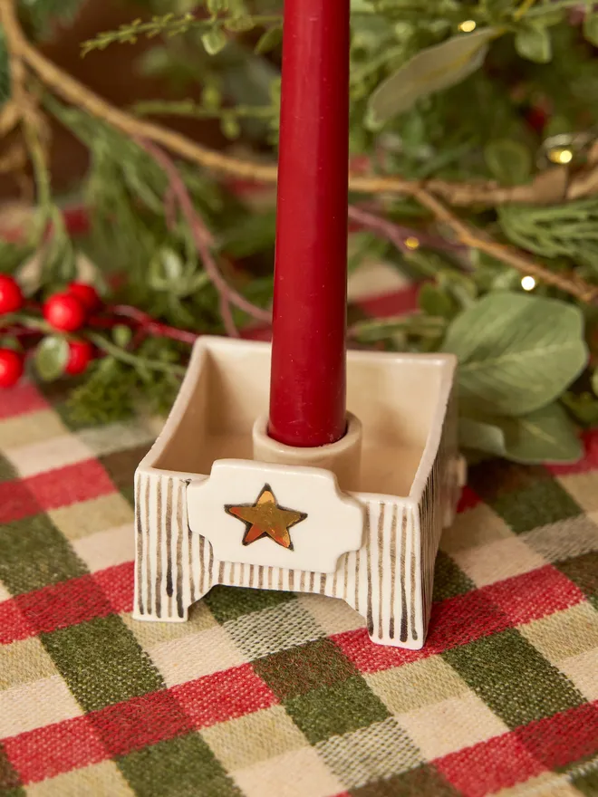 square star candle holder being held