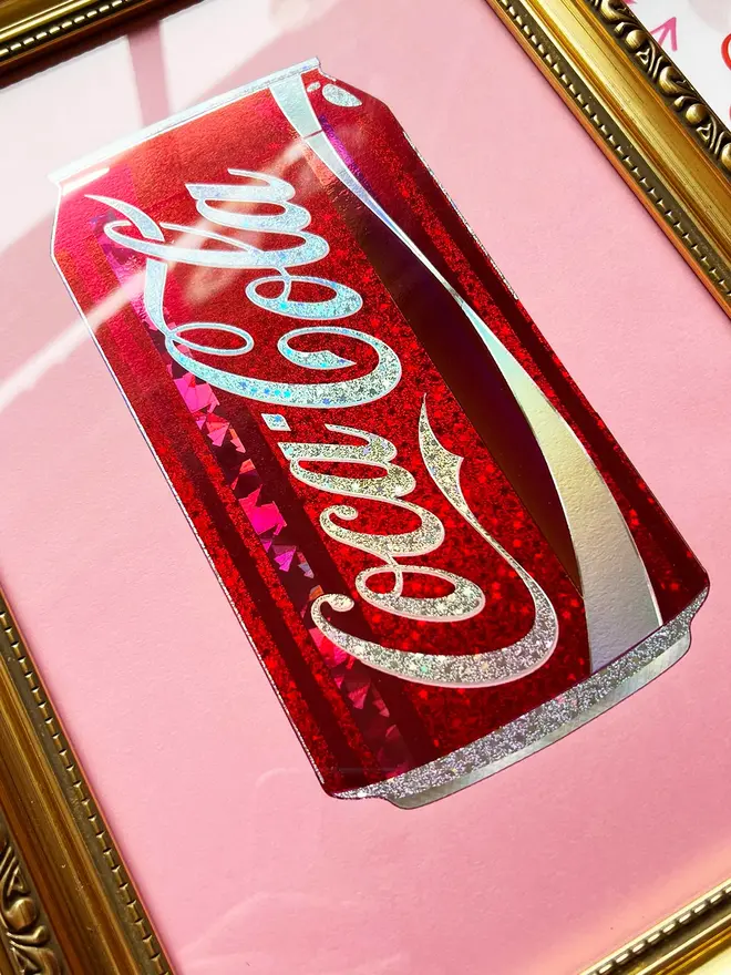 'Coca Cola' Can ScreenPrint, a person holding a colourful coca cola can print in a frame. 