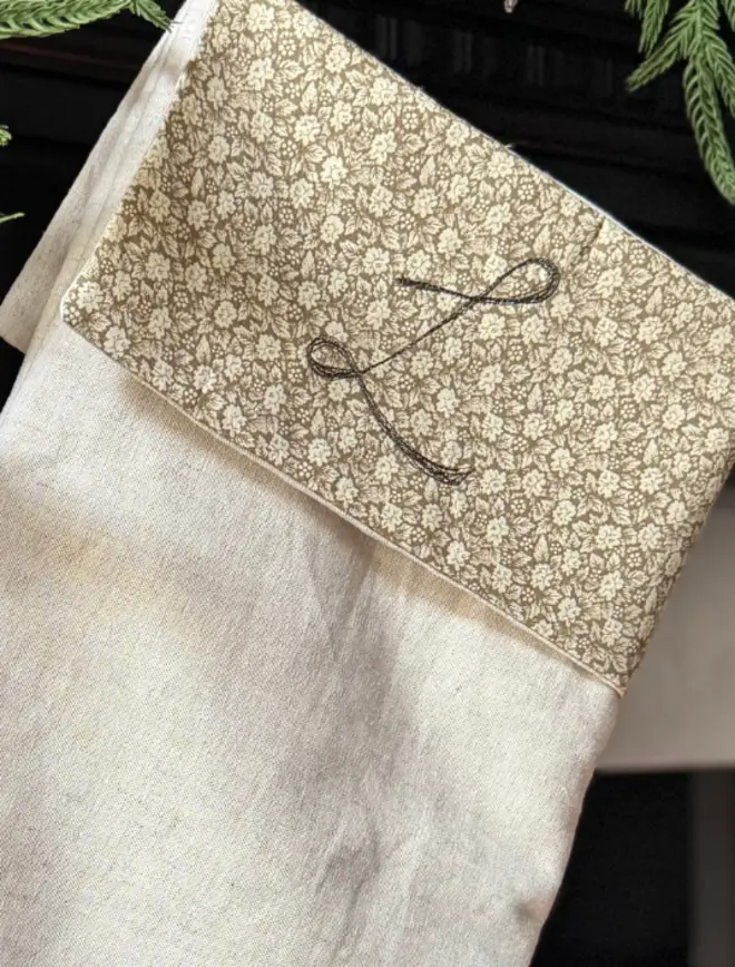 Floral Mini Christmas Stocking. close up of embroidered Letter L on cuff