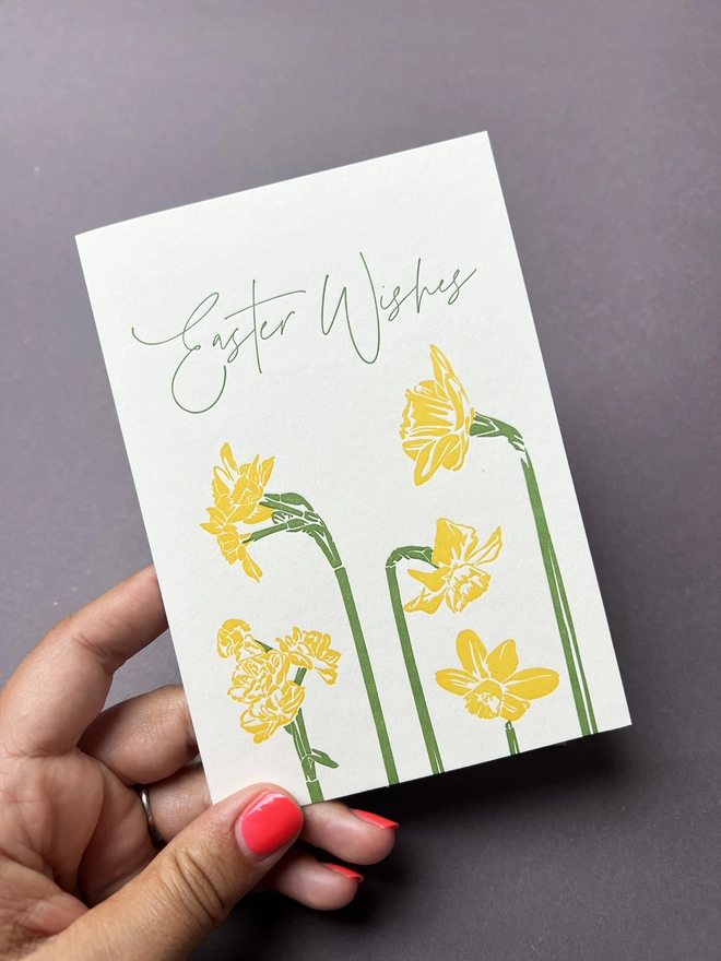 "Easter Wishes" card being held with a card.