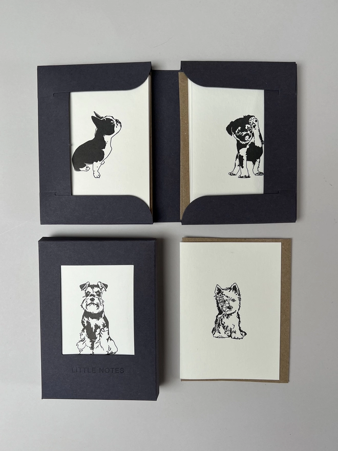 Four of the eight puppy designs that are included in the plastic free gift box for little cards