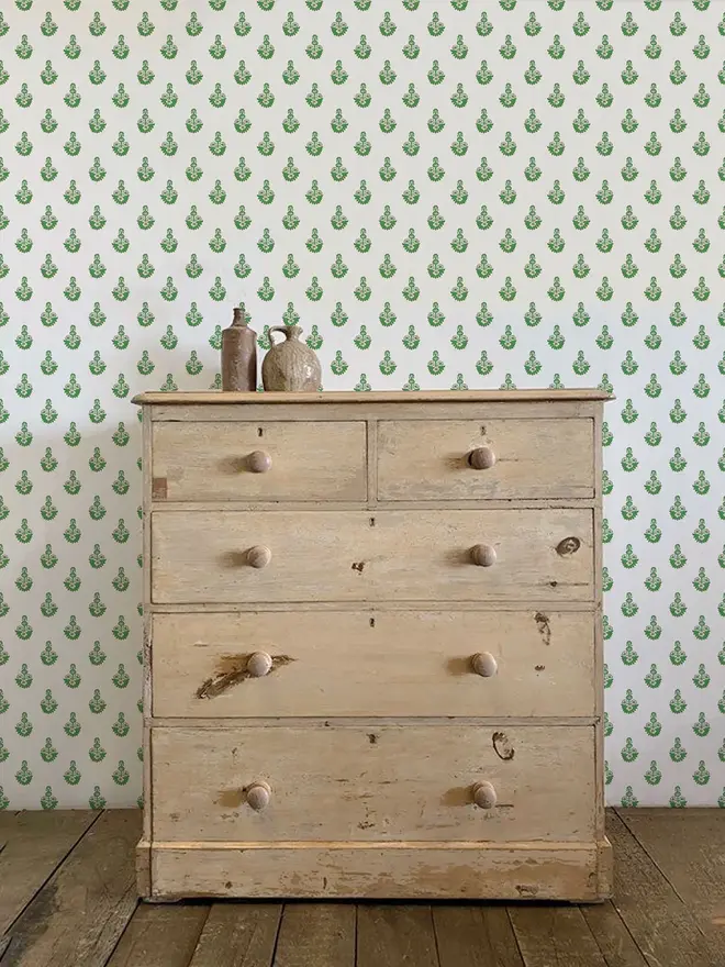 dana illustrated floral wallpaper. a white and green patterned wallpaper on a wall.