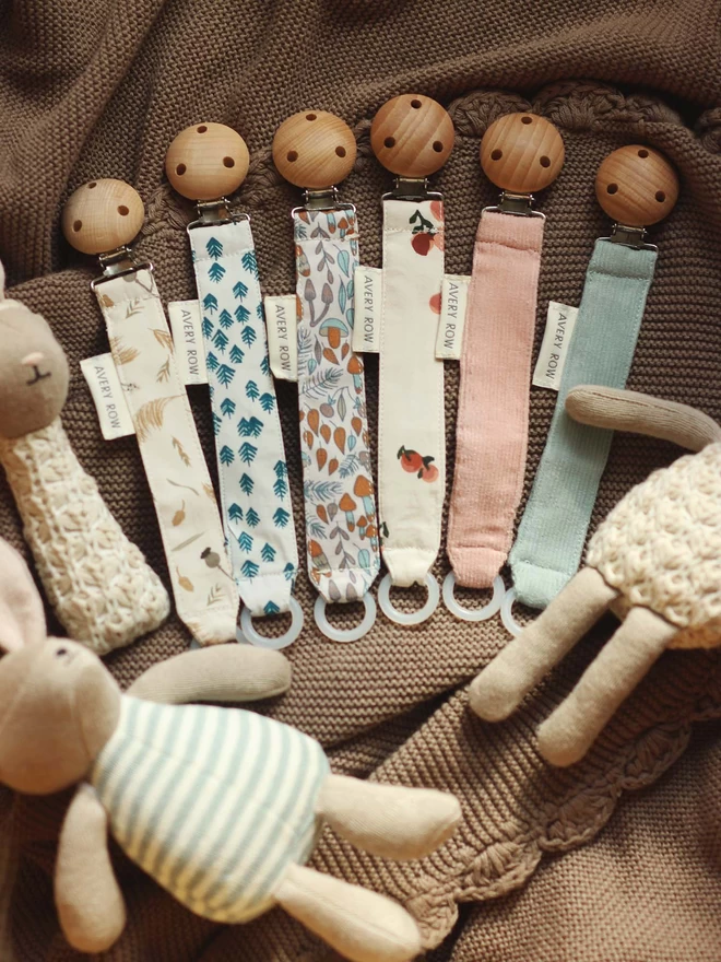 A pacifier holder sets with a bunch of rattles