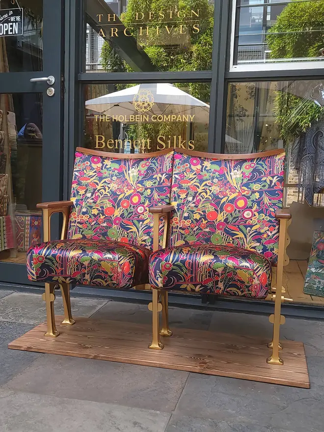 Grand Tiffany cinema seats outside a showroom with both seats down