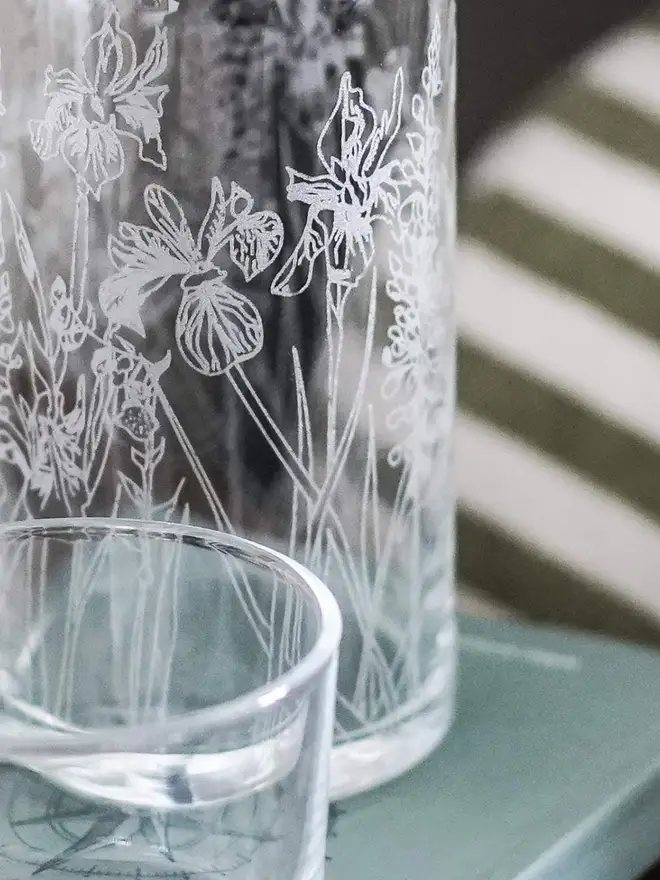Floral Mini Carafe & Glass Set, on a clear table. 