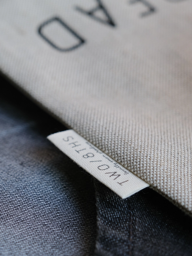 The makers label for Two 8ths sewn into a linen food storage bag